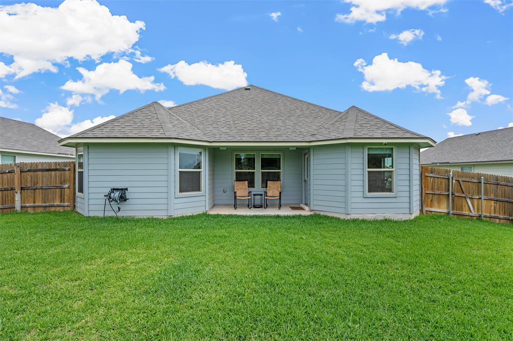 10712 Peperak Court Waco, TX 76708 - Photo 22 of 25 a front view of a house with a garden