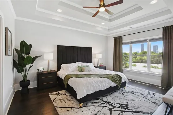 a bedroom with a large bed and a window