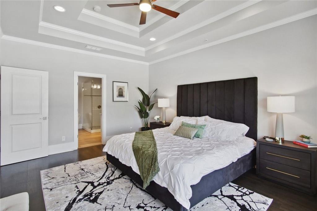 692 Drewry Street Northeast Atlanta, GA 30306 - Photo 12 of 25 a bedroom with a bed and wooden floor