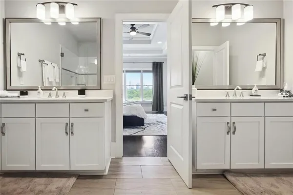 a bathroom with a sink a vanity and a mirror