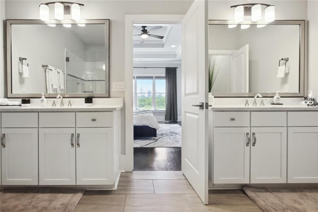 692 Drewry Street Northeast Atlanta, GA 30306 - Photo 14 of 25 a bathroom with a sink a vanity and a mirror