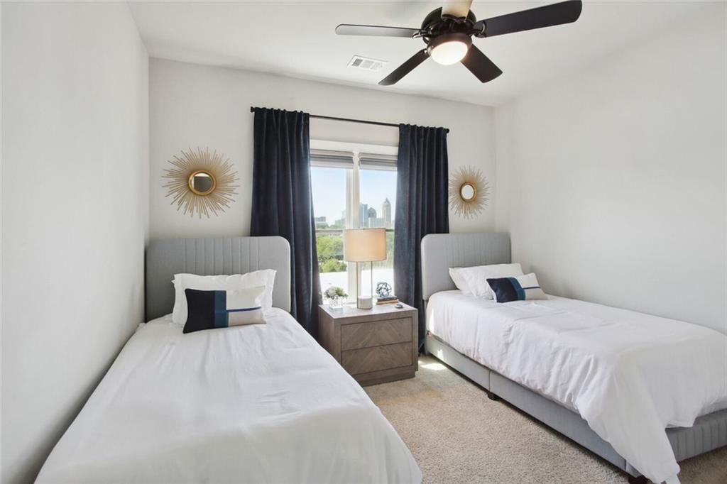 692 Drewry Street Northeast Atlanta, GA 30306 - Photo 16 of 25 a bedroom with a large bed and a window