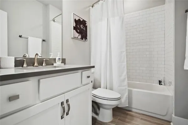 a bathroom with a toilet sink and bathtub
