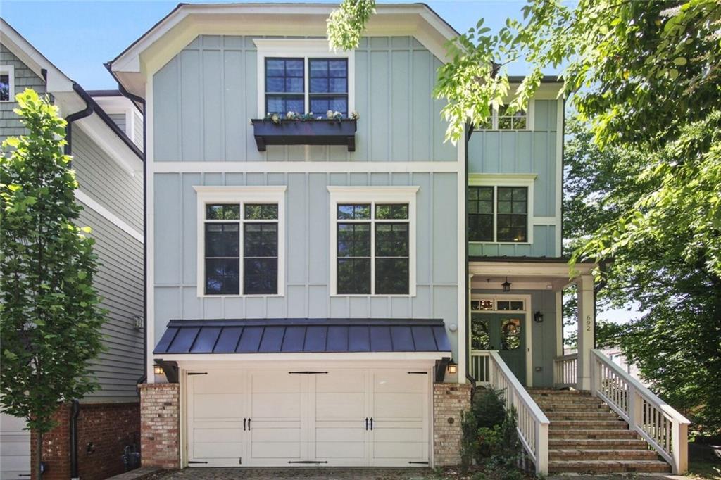 692 Drewry Street Northeast Atlanta, GA 30306 - Photo 2 of 25 a view of a house with more windows and brick walls
