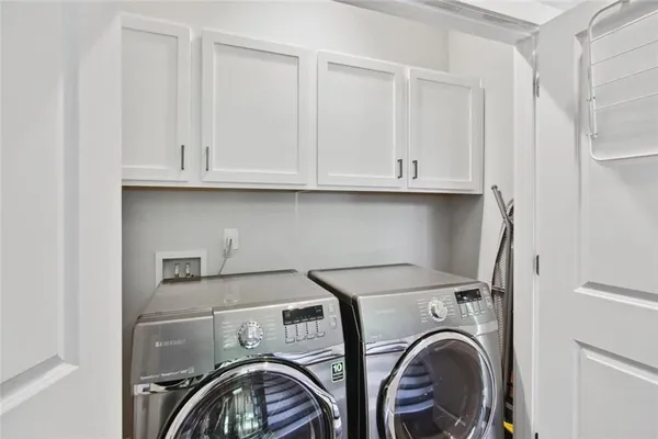 a view of storage and utility room with washer and dryer