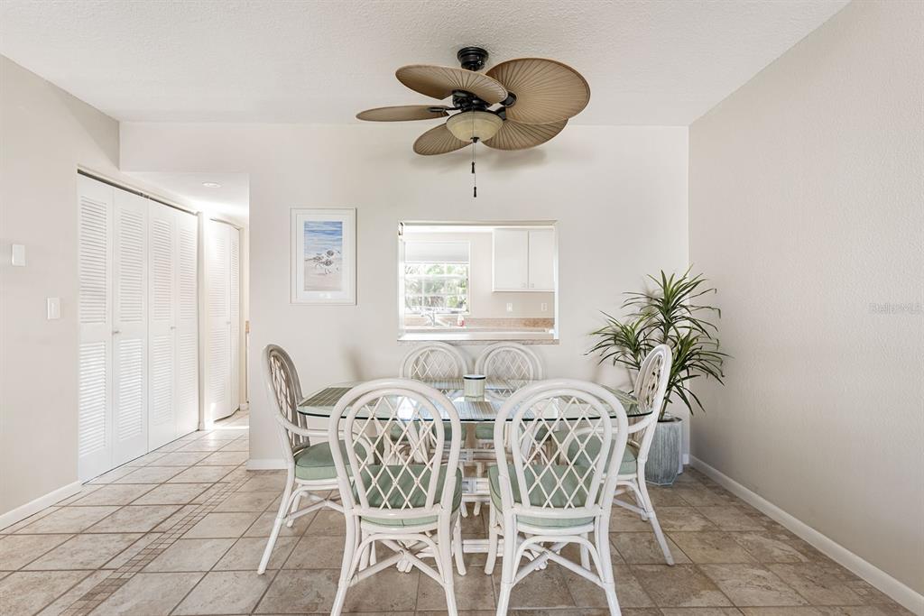 1531 Placida Road, Unit 8101 Englewood, FL 34223 - Photo 12 of 76 a view of a dining room with furniture and window