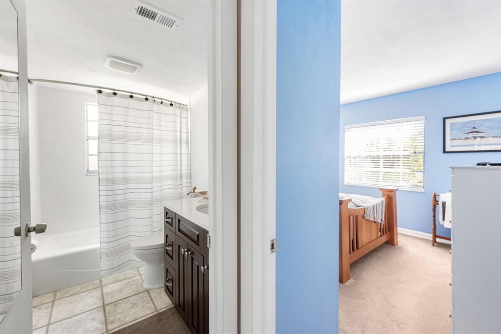 1531 Placida Road, Unit 8101 Englewood, FL 34223 - Photo 19 of 76 a bathroom with a sink a washer and dryer