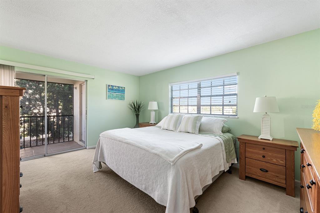 1531 Placida Road, Unit 8101 Englewood, FL 34223 - Photo 26 of 76 a bedroom with a bed and a window