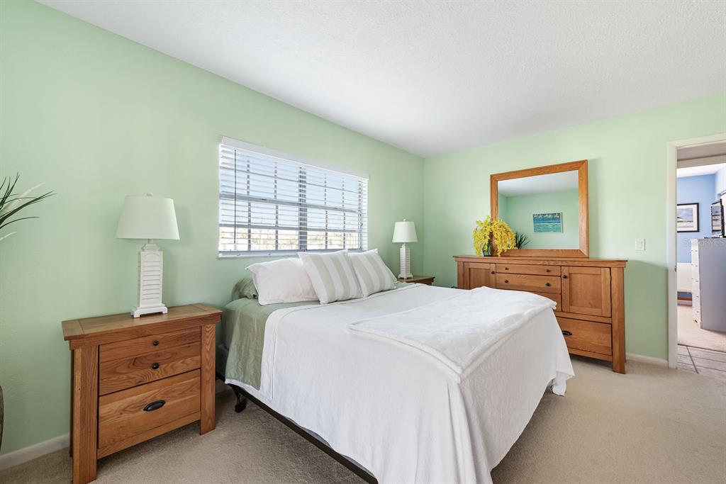 1531 Placida Road, Unit 8101 Englewood, FL 34223 - Photo 27 of 76 a bedroom with a bed and a window