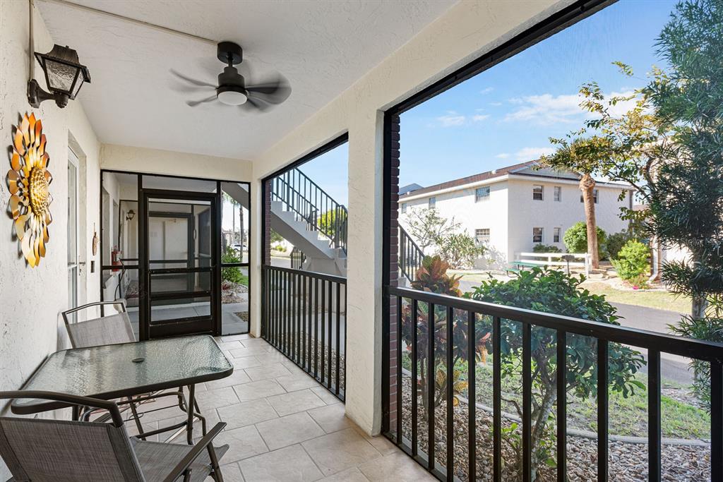 1531 Placida Road, Unit 8101 Englewood, FL 34223 - Photo 39 of 76 a view of a porch with furniture and a window
