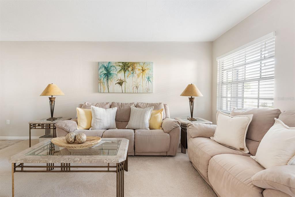 1531 Placida Road, Unit 8101 Englewood, FL 34223 - Photo 7 of 76 a living room with furniture and a window