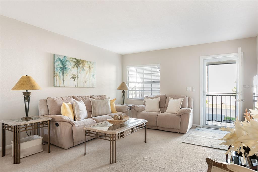 1531 Placida Road, Unit 8101 Englewood, FL 34223 - Photo 8 of 76 a living room with furniture and a window