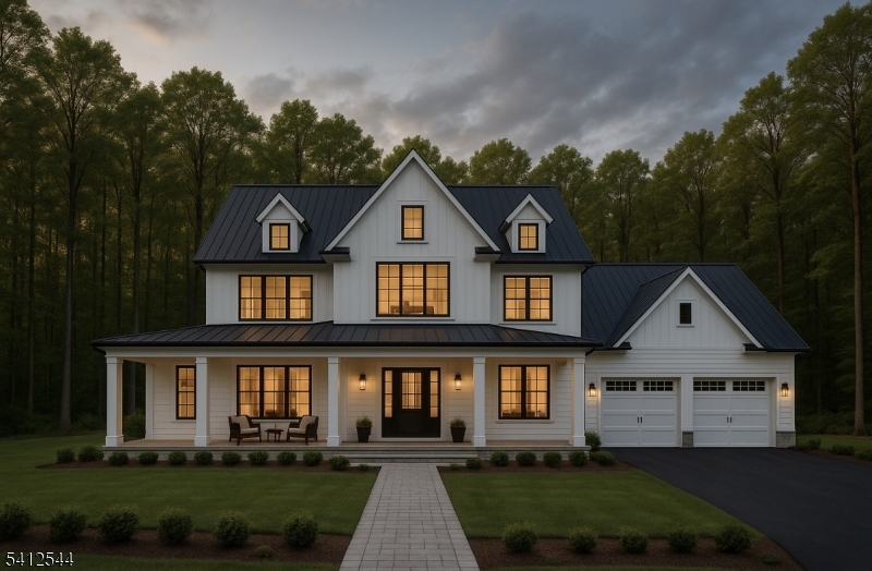 a front view of a house with a yard and trees
