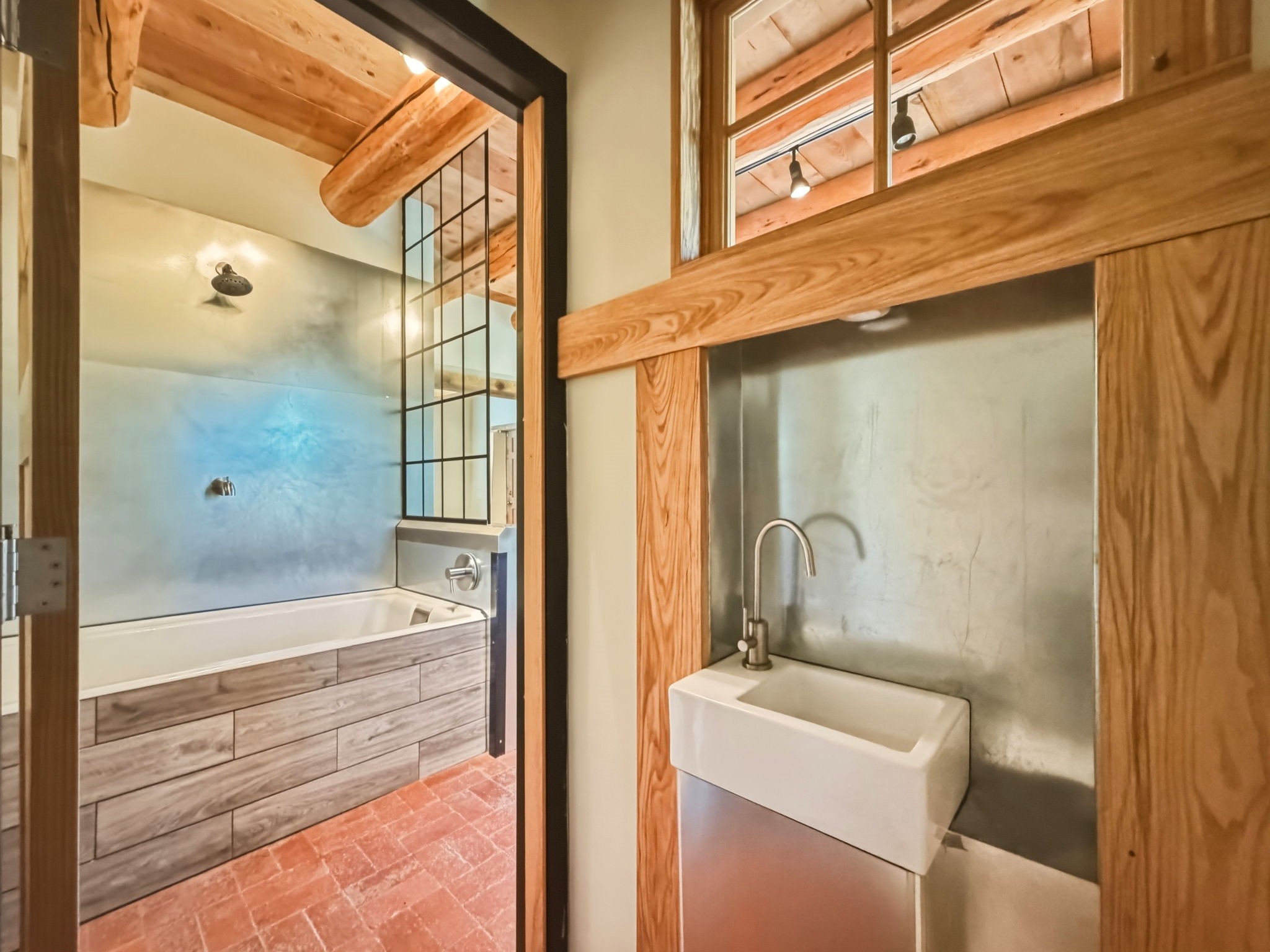 1692 Upper Canyon Road Santa Fe, NM 87501 - Photo 26 of 52 Deep soaking tub shower anchors this adaptable retreat space.