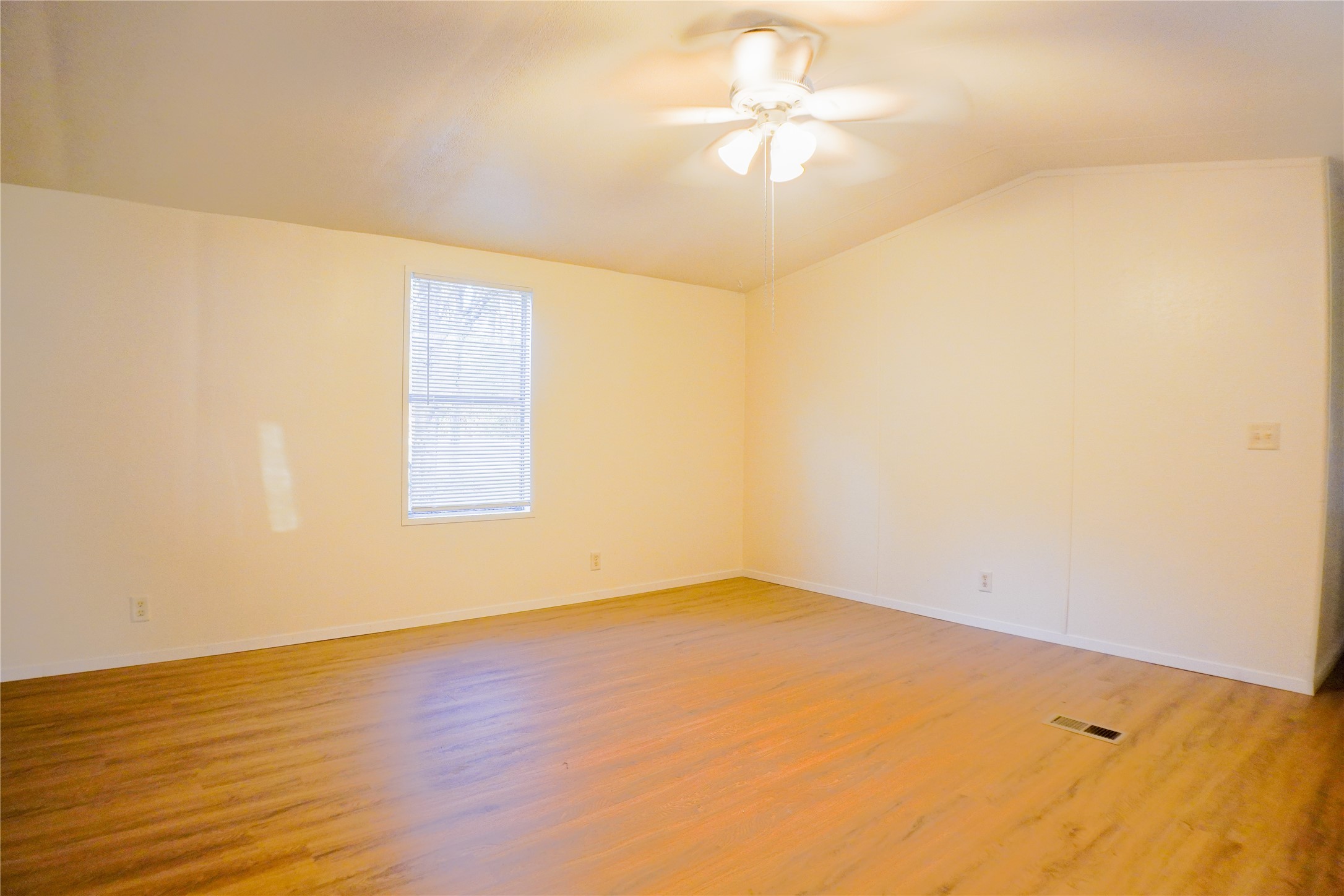 3408 Old Houston Road Huntsville, TX 77340 - Photo 4 of 10 an empty room with a window and a fan