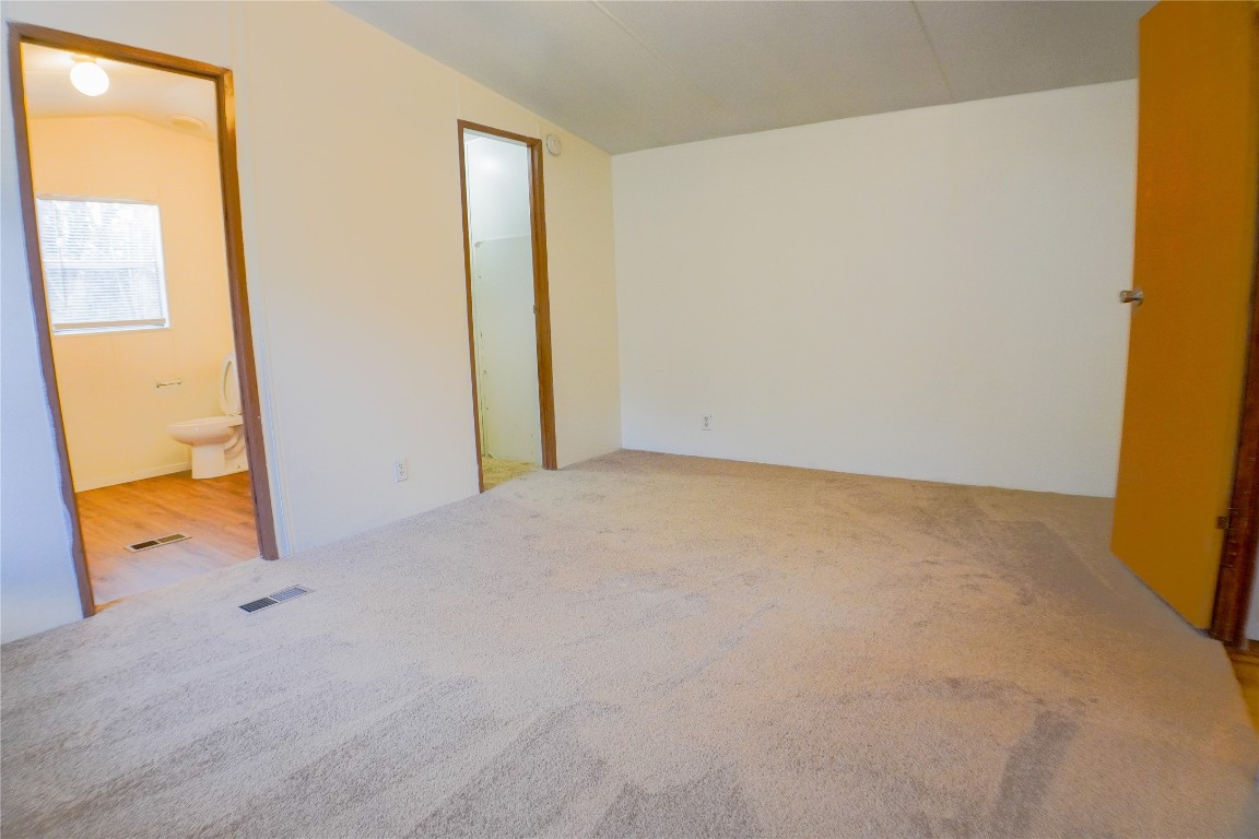 3408 Old Houston Road Huntsville, TX 77340 - Photo 8 of 10 an empty room with a door