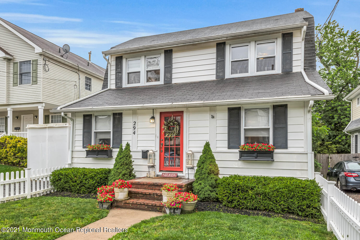294 Spring Street Red Bank, NJ 07701 - Photo 1 of 21 a front view of a house with a yard table and chairs