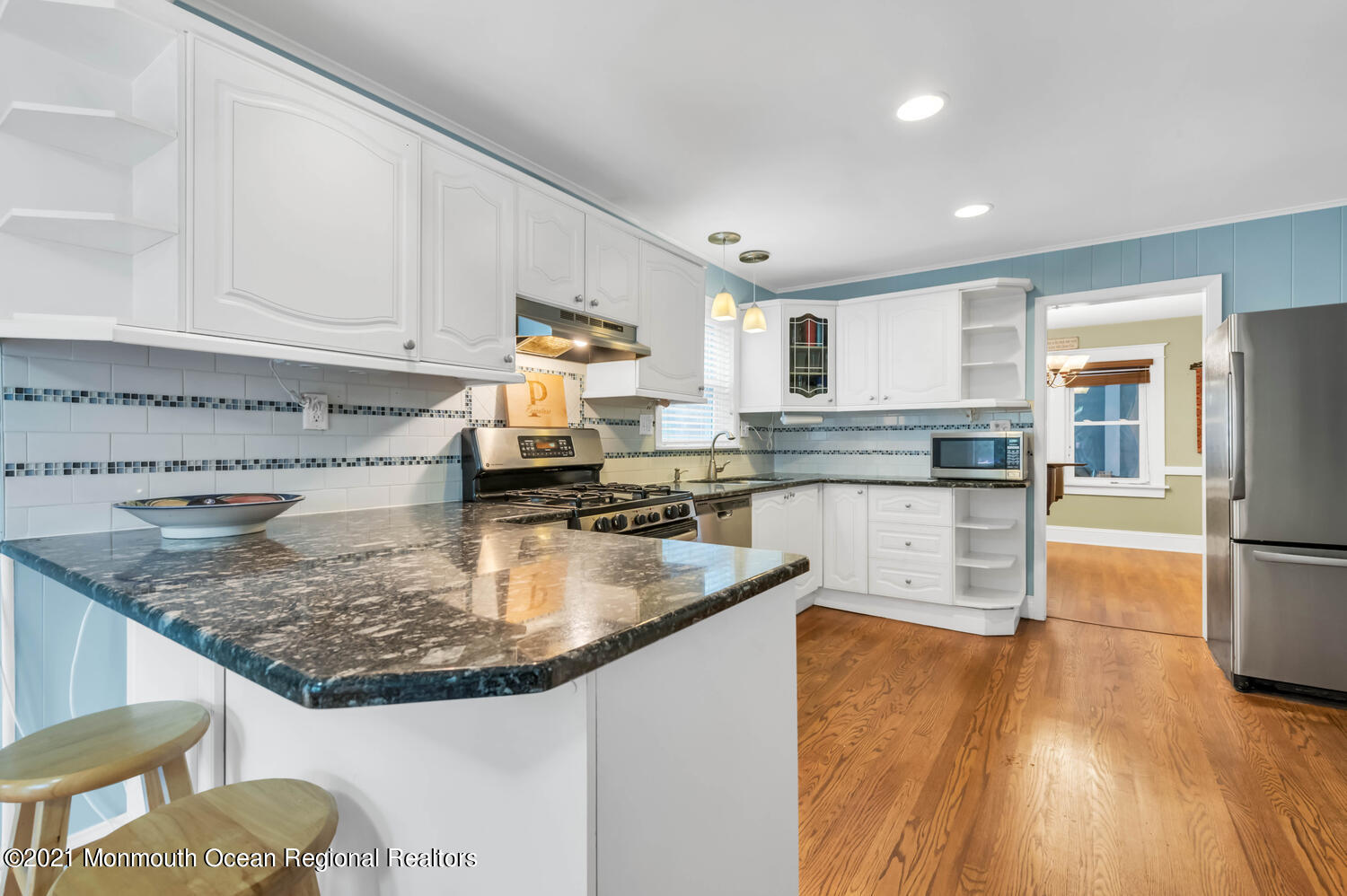 294 Spring Street Red Bank, NJ 07701 - Photo 9 of 21 a kitchen with stainless steel appliances granite countertop a sink stove and refrigerator