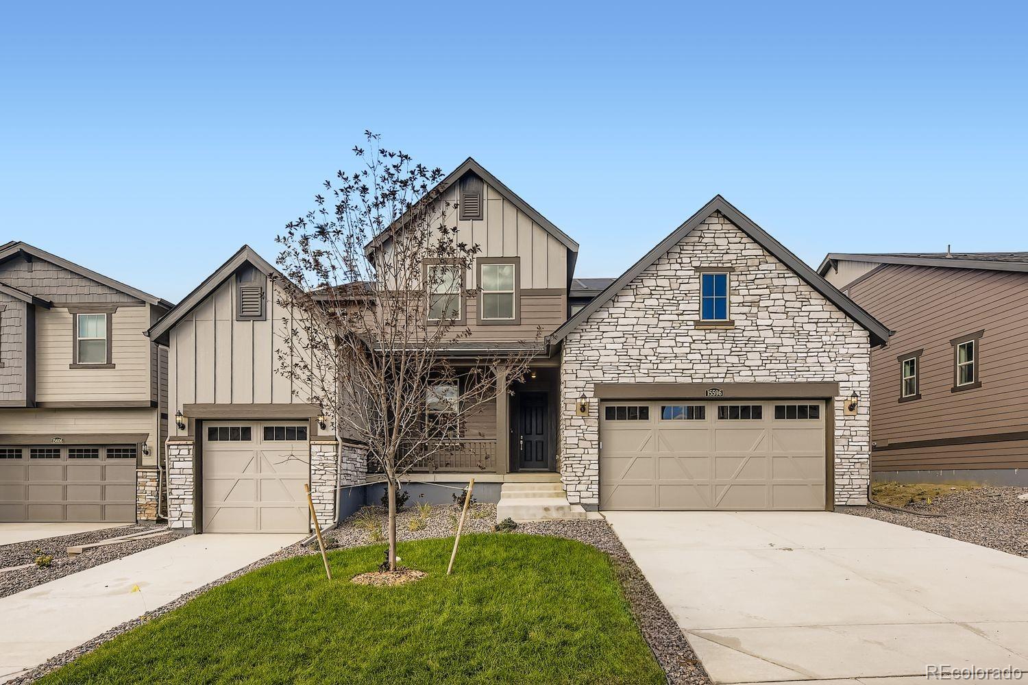 a front view of a house with a yard