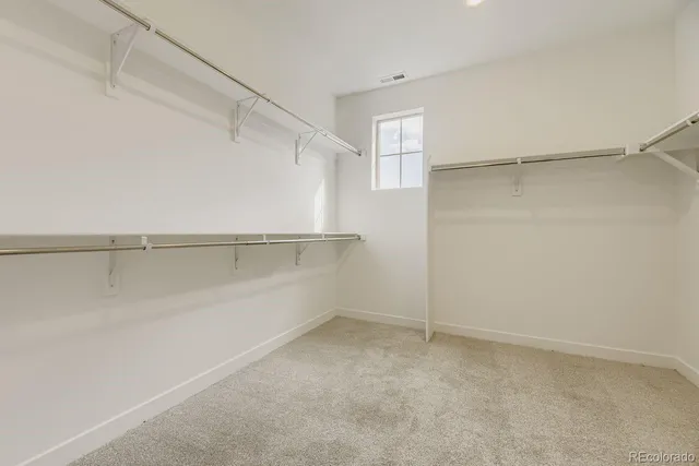 a view of an empty walk in closet