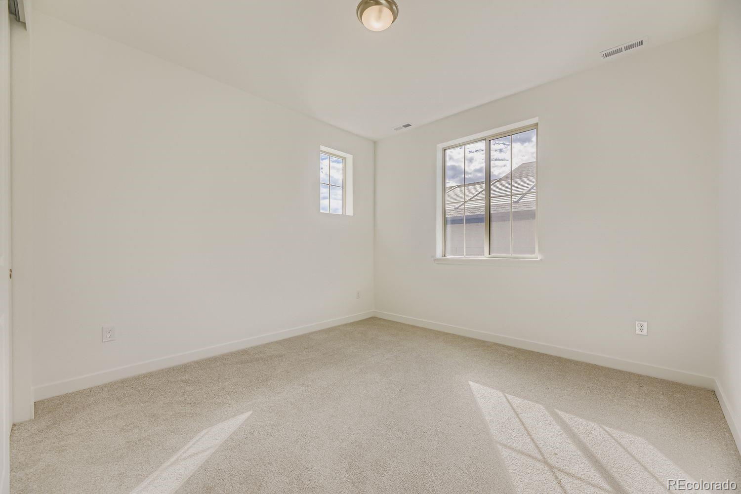 15596 West Beloit Avenue Morrison, CO 80465 - Photo 17 of 23 an empty room with windows