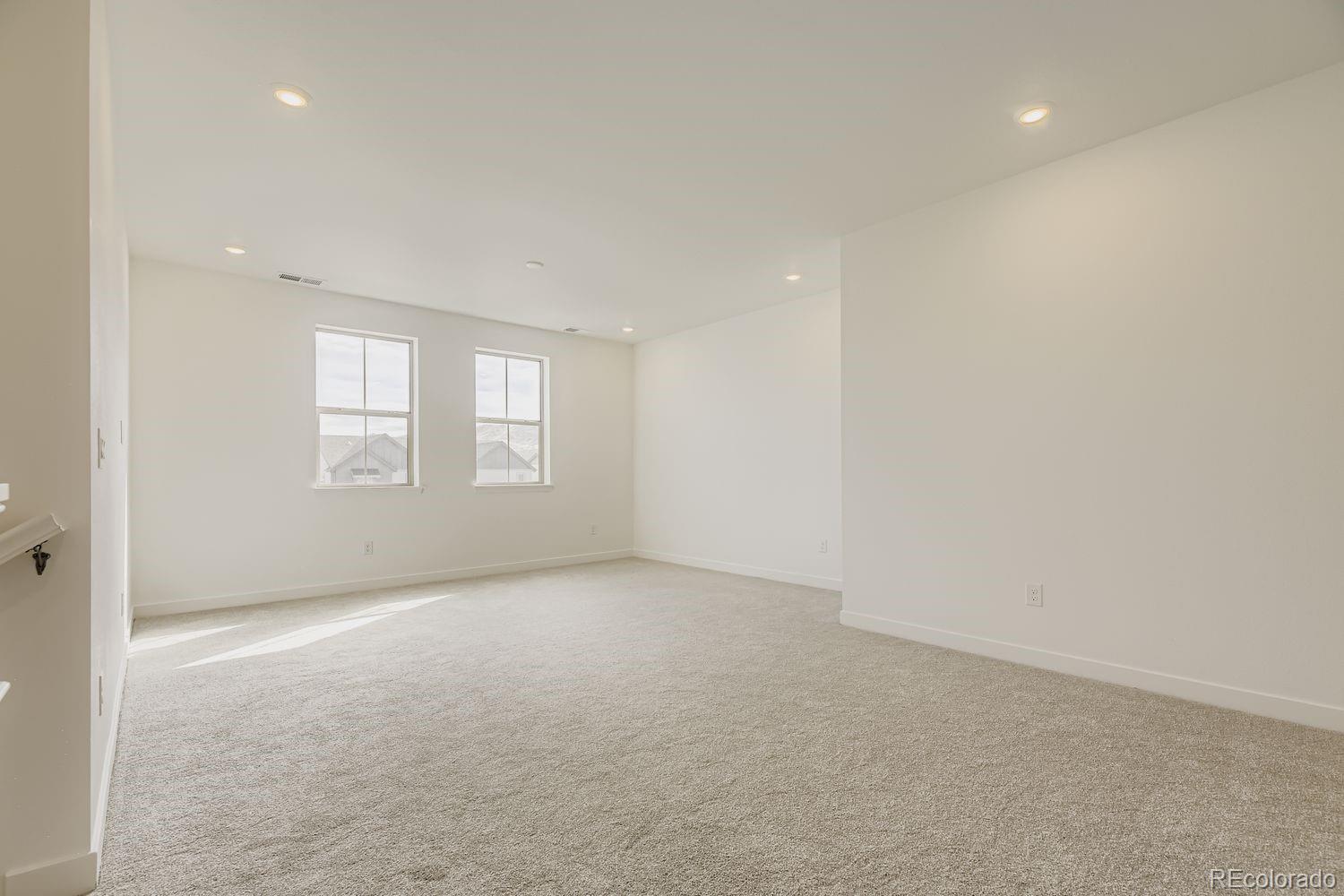 15596 West Beloit Avenue Morrison, CO 80465 - Photo 8 of 23 an empty room with windows