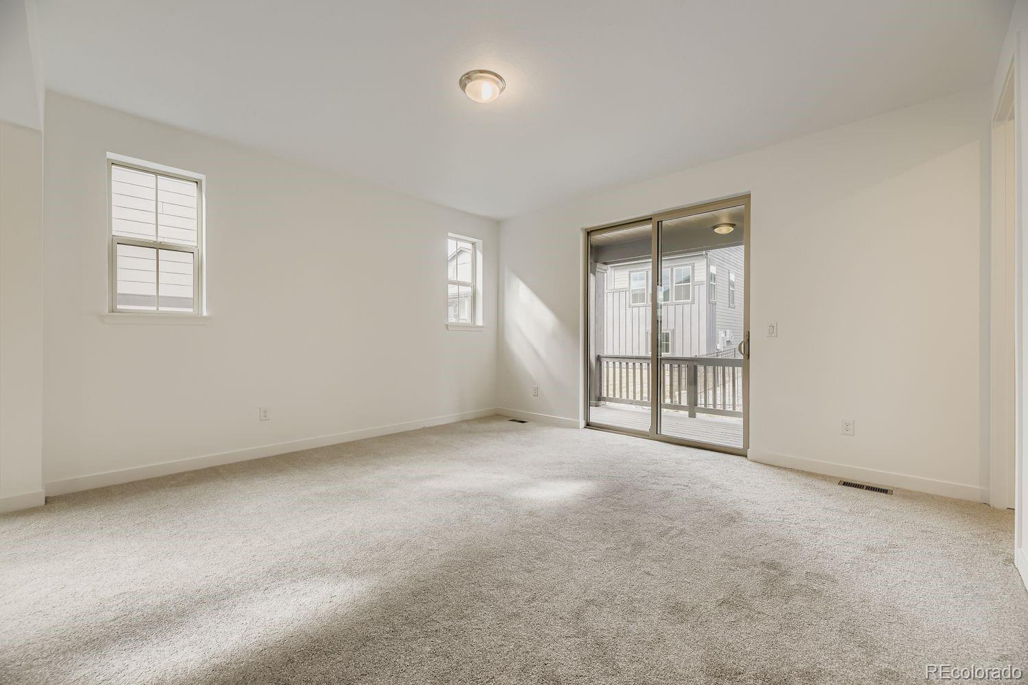 15596 West Beloit Avenue Morrison, CO 80465 - Photo 9 of 23 an empty room with windows