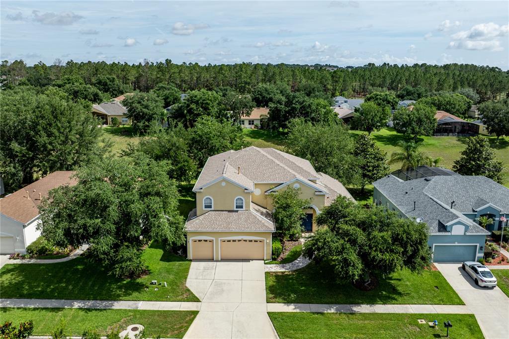 2718 Knightsbridge Road Clermont, FL 34711 - Photo 67 of 72 an aerial view of a house with a yard basket ball court and outdoor seating