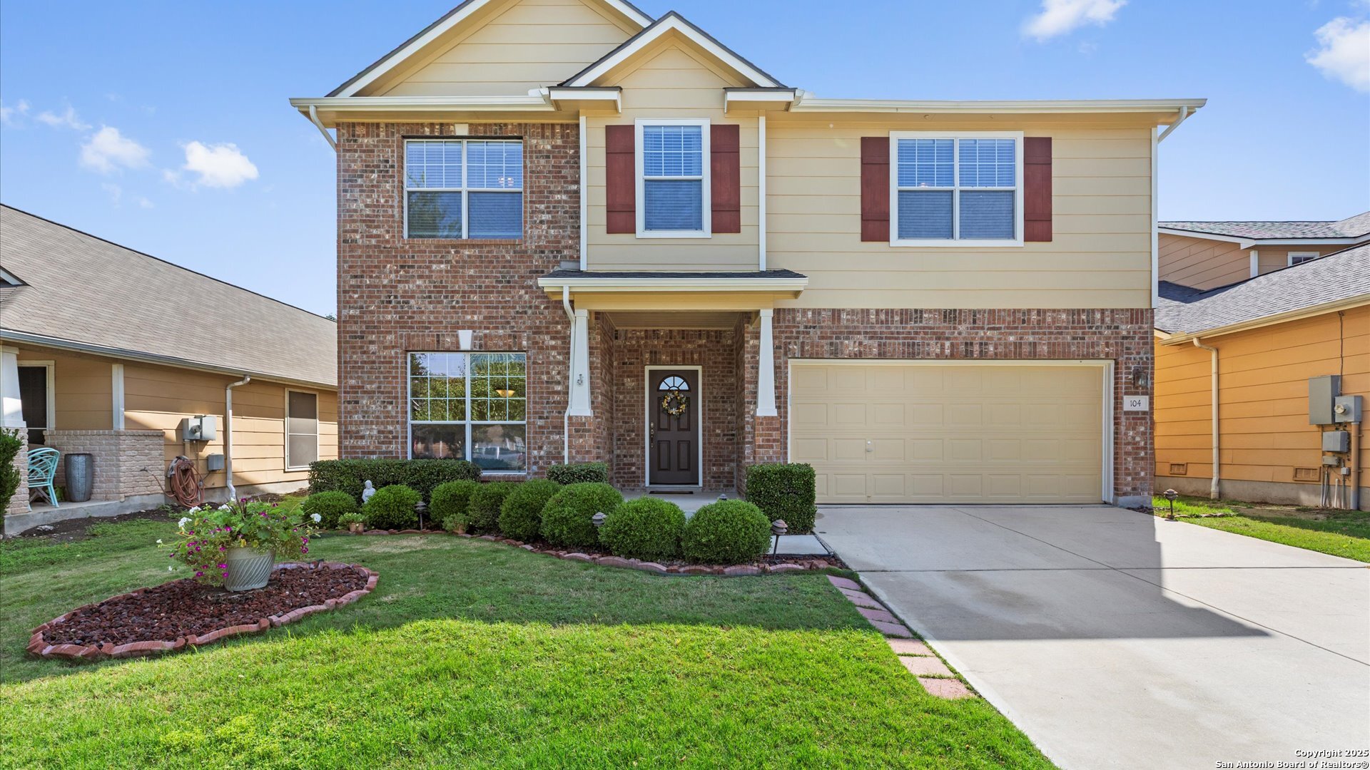 a front view of a house with garden