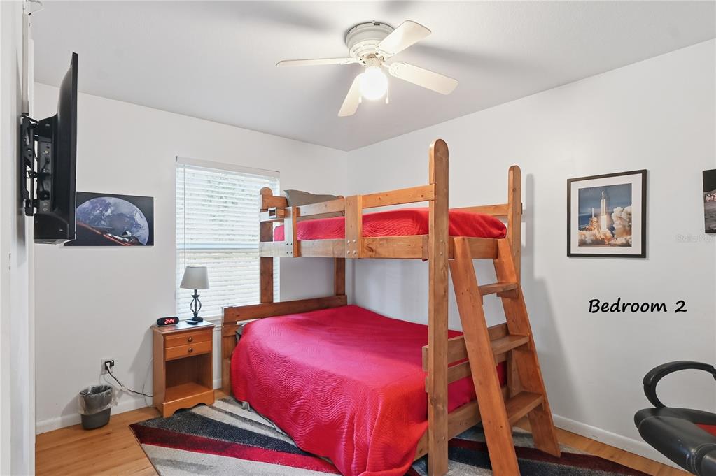 22205 North County Road 349 O'Brien, FL 32071 - Photo 14 of 73 a bed room with a bed and a chandelier