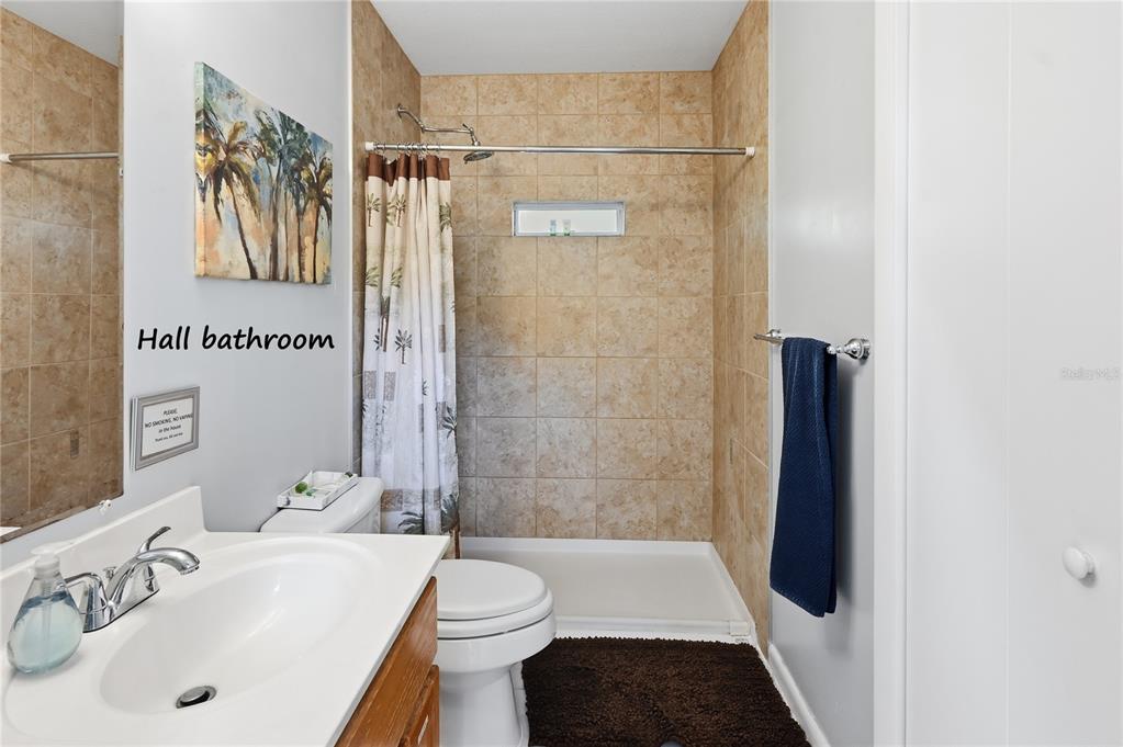 22205 North County Road 349 O'Brien, FL 32071 - Photo 16 of 73 a bathroom with a sink a toilet and shower