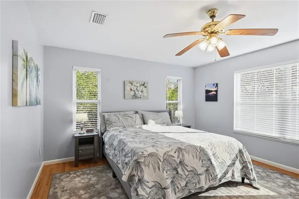 a bedroom with furniture and a chandelier