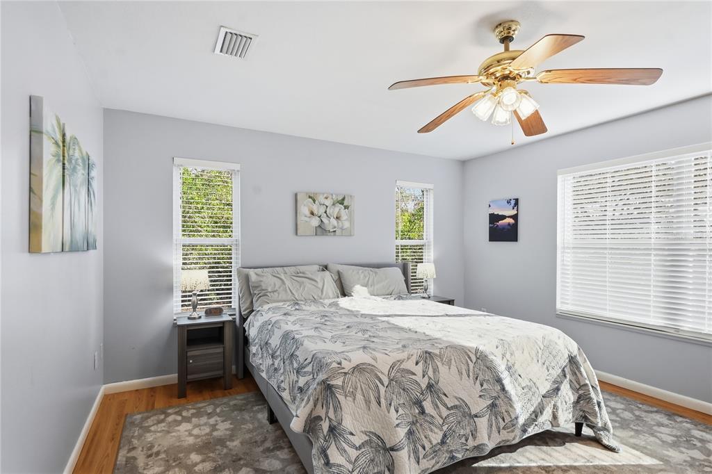 22205 North County Road 349 O'Brien, FL 32071 - Photo 16 of 68 a bedroom with a bed and a chandelier