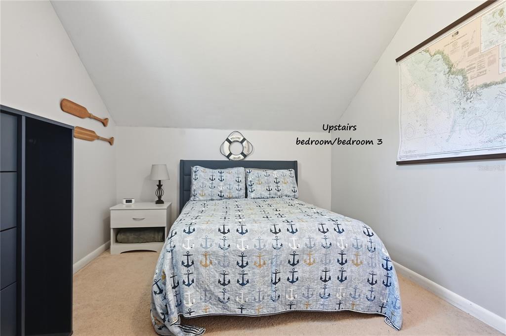 22205 North County Road 349 O'Brien, FL 32071 - Photo 19 of 73 a bedroom with a bed and painting on the wall