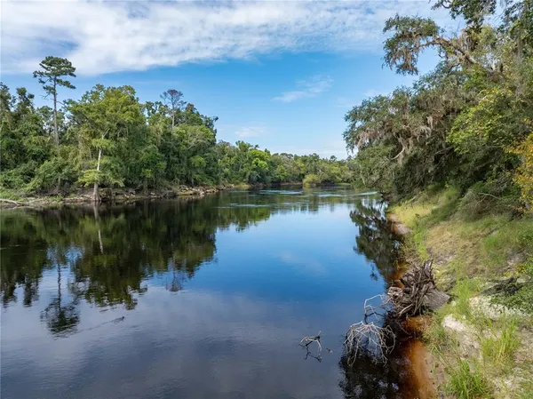 a front view of a house with outdoor seating