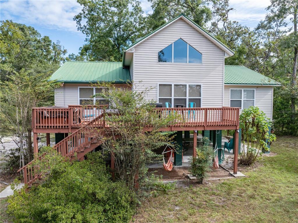 22205 North County Road 349 O'Brien, FL 32071 - Photo 36 of 68 a view of a house with brick walls and potted plants