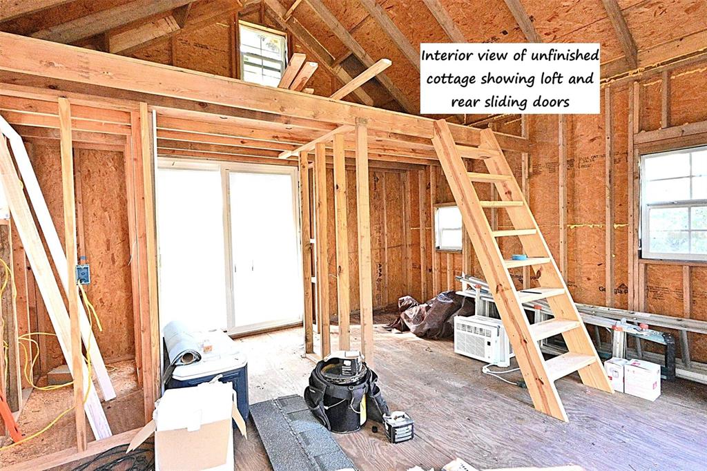 22205 North County Road 349 O'Brien, FL 32071 - Photo 66 of 73 a view of a living room with a large window and furniture