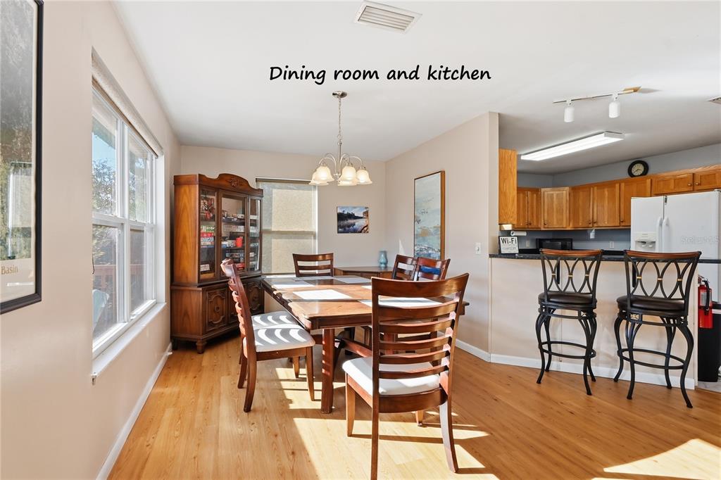 22205 North County Road 349 O'Brien, FL 32071 - Photo 7 of 73 a view of a dining room with furniture and wooden floor