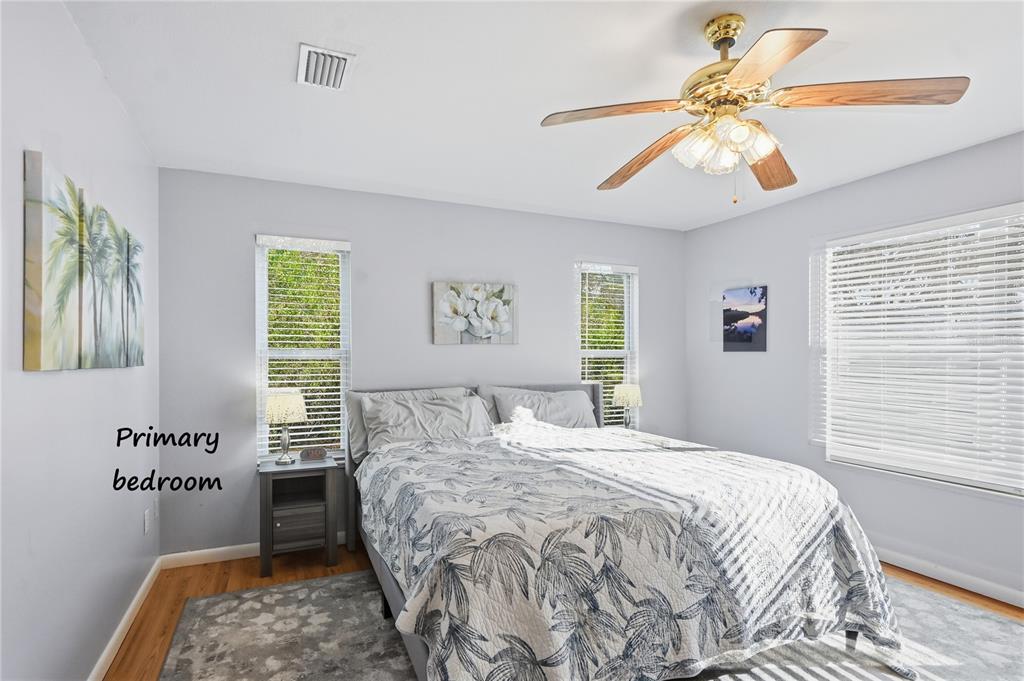 22205 North County Road 349 O'Brien, FL 32071 - Photo 9 of 73 a bedroom with a bed and a chandelier