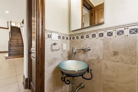 a bathroom with a shower toilet and sink