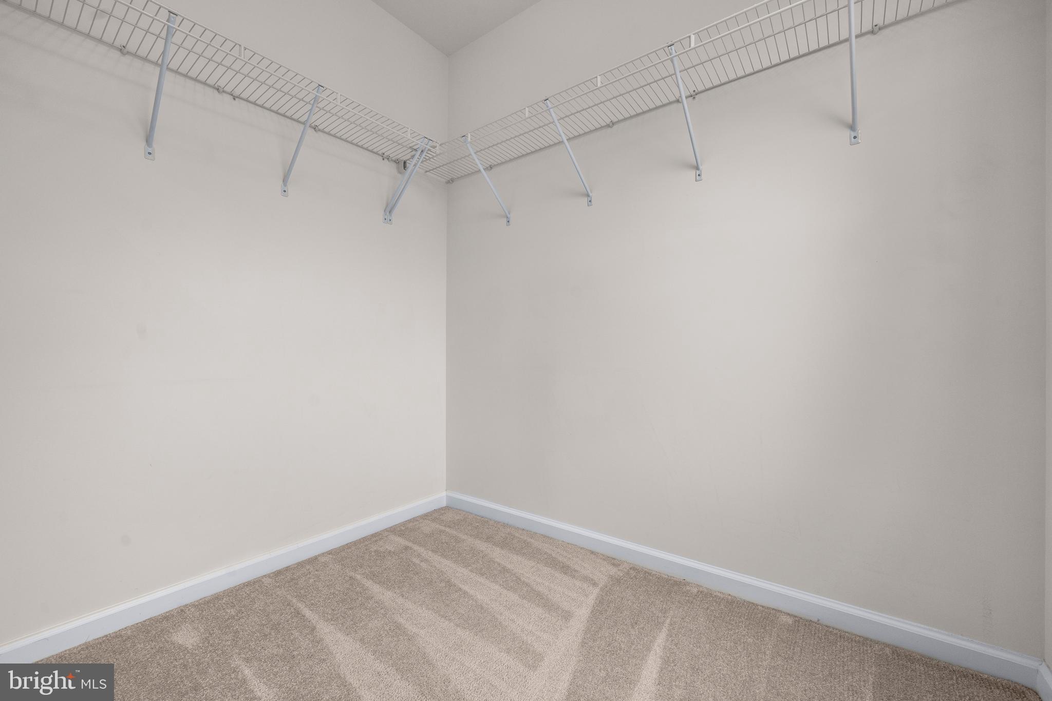 9516 Kimbleton Hall Loop Manassas Park, VA 20111 - Photo 19 of 51 a view of a room with racks on the wall