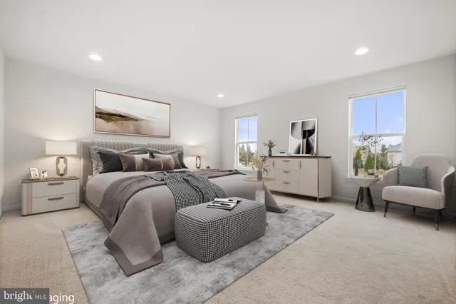 a spacious bedroom with a bed and a couch