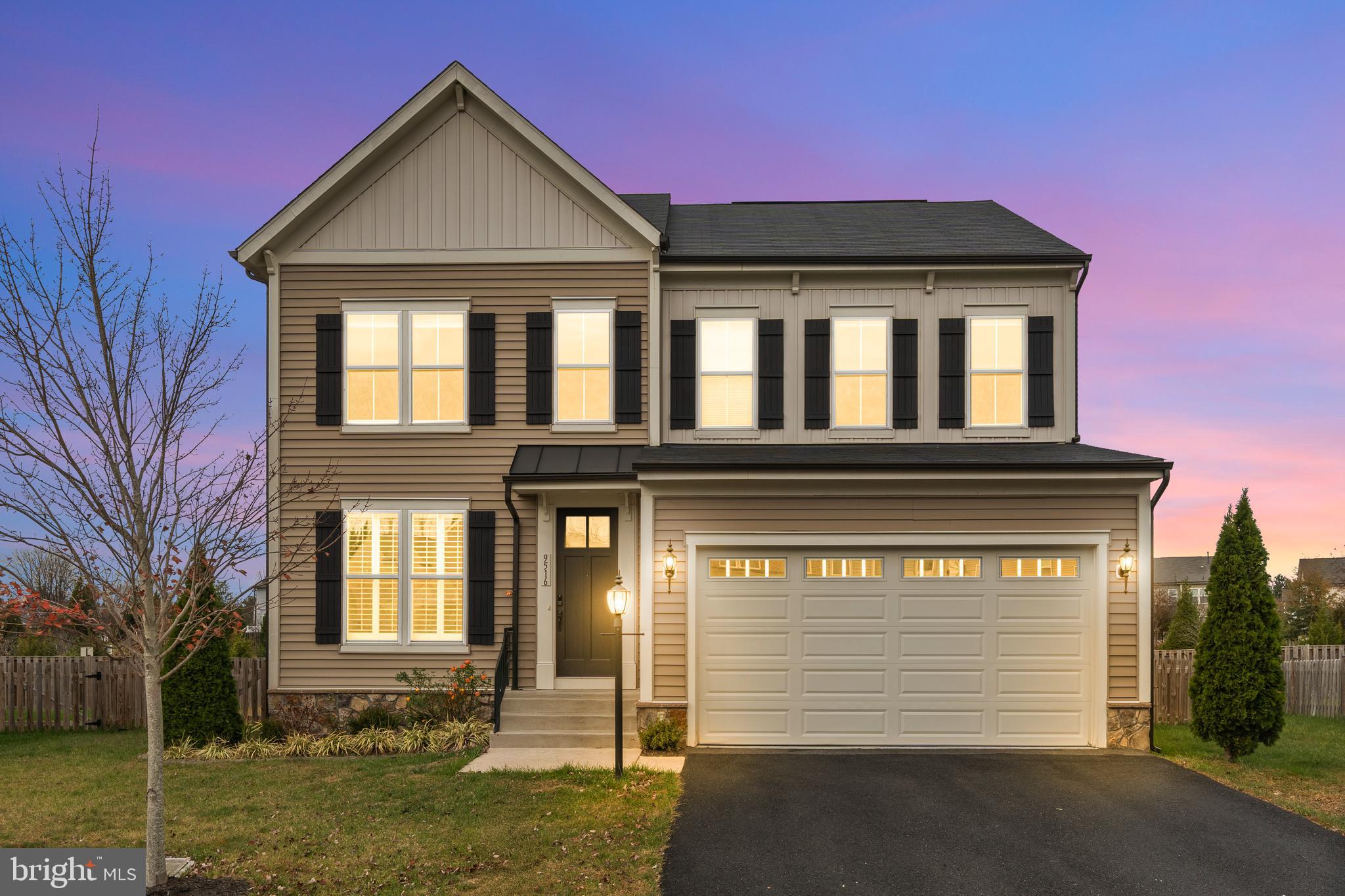 9516 Kimbleton Hall Loop Manassas Park, VA 20111 - Photo 2 of 51 a front view of a house with garden