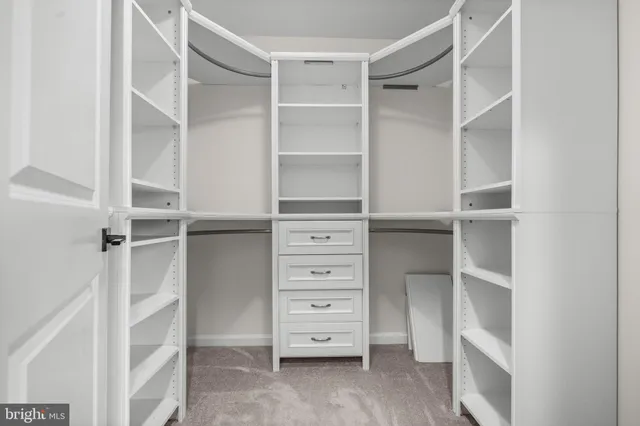 a bathroom with a shower sink and mirror