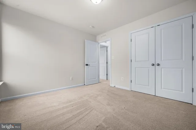 a bathroom with a toilet a sink a mirror a bathtub and vanity