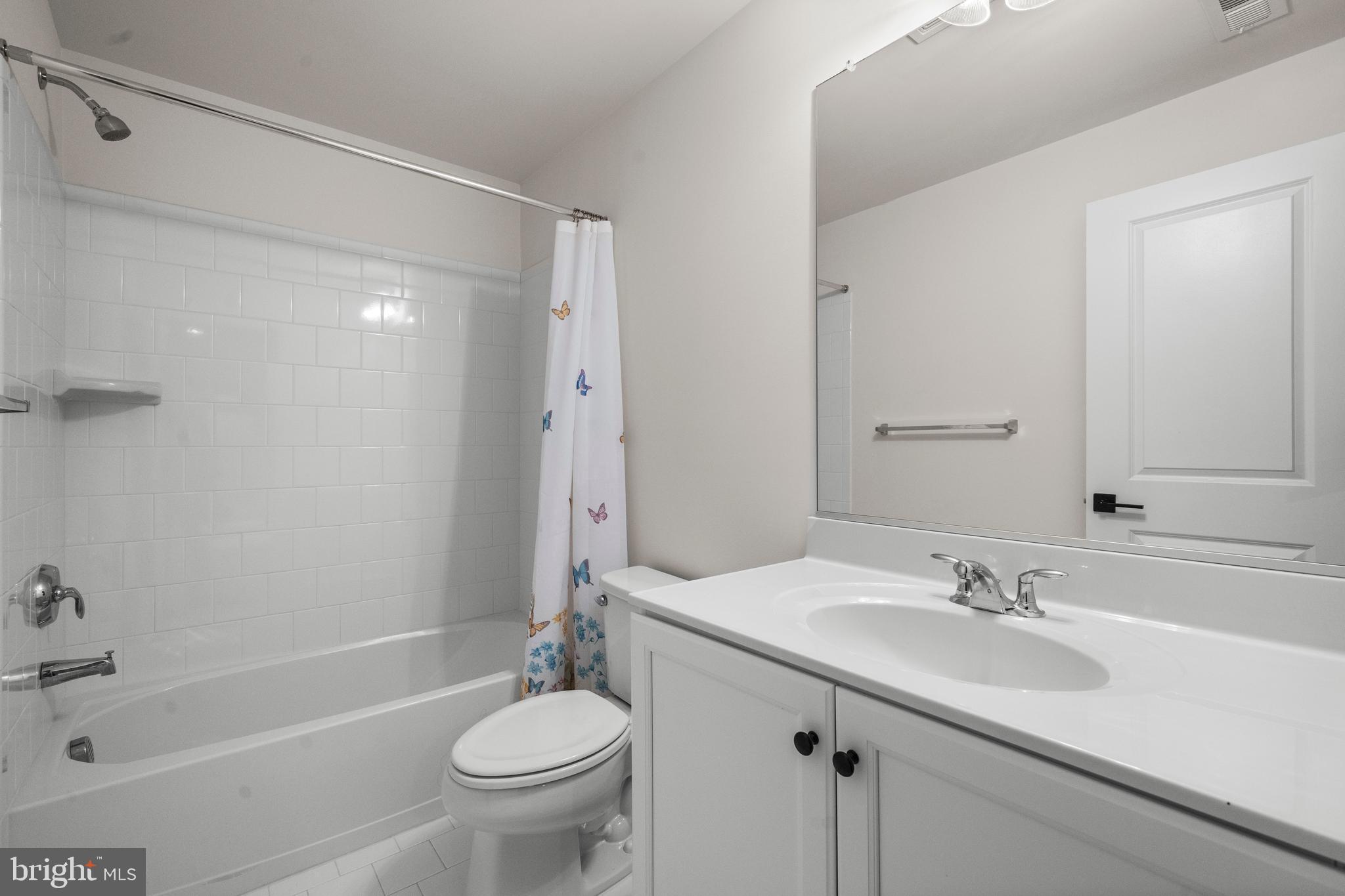 9516 Kimbleton Hall Loop Manassas Park, VA 20111 - Photo 35 of 51 a bathroom with a sink a toilet and shower