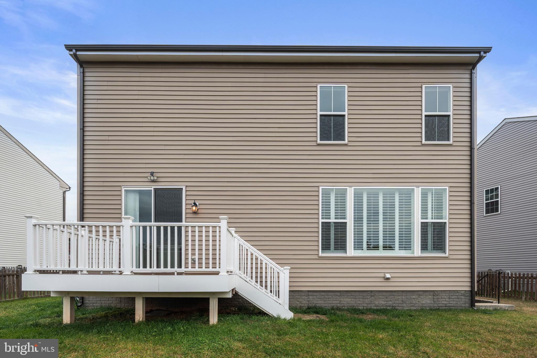 9516 Kimbleton Hall Loop Manassas Park, VA 20111 - Photo 38 of 51 a front view of a house with a yard