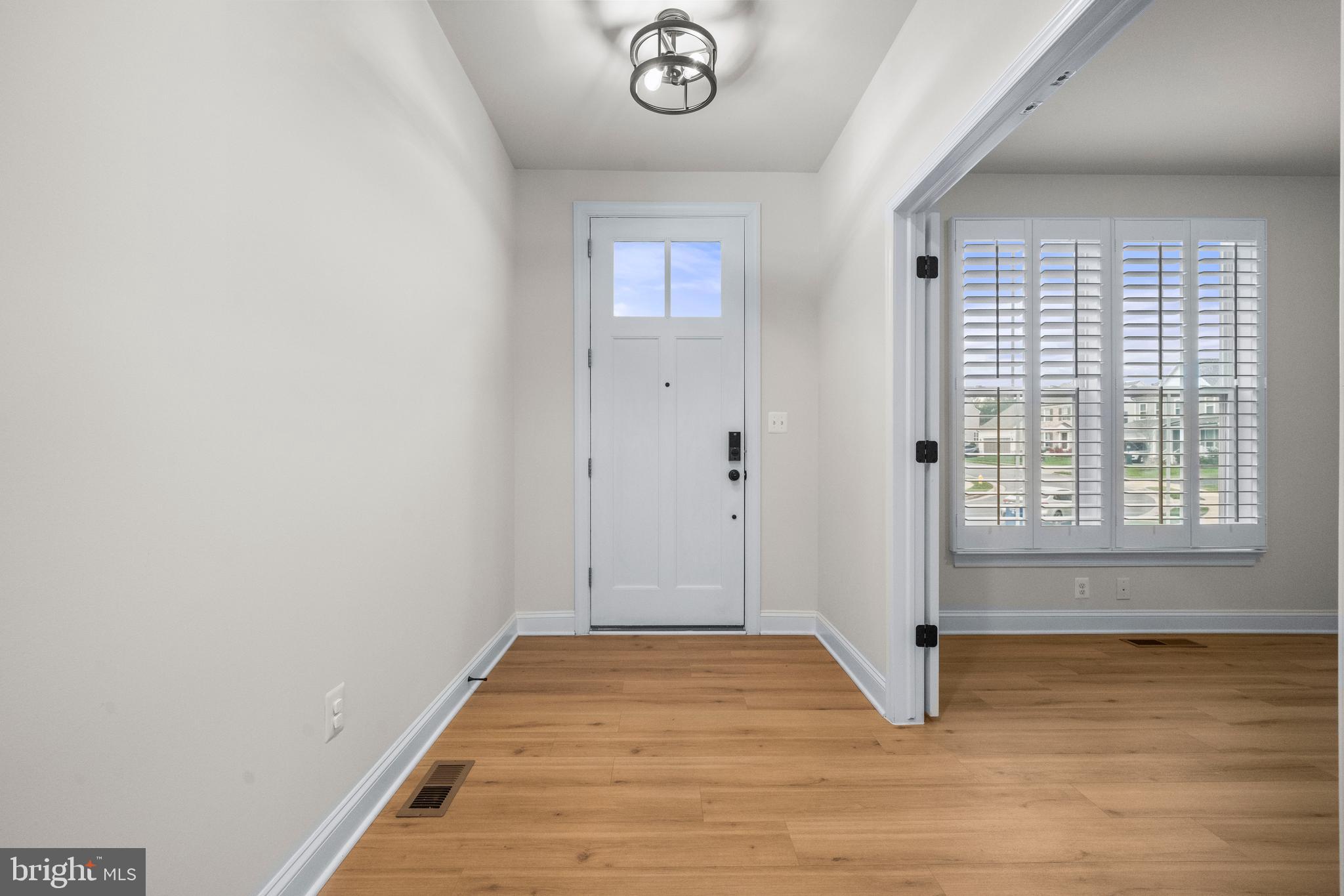 9516 Kimbleton Hall Loop Manassas Park, VA 20111 - Photo 4 of 51 a view of an empty room with a window