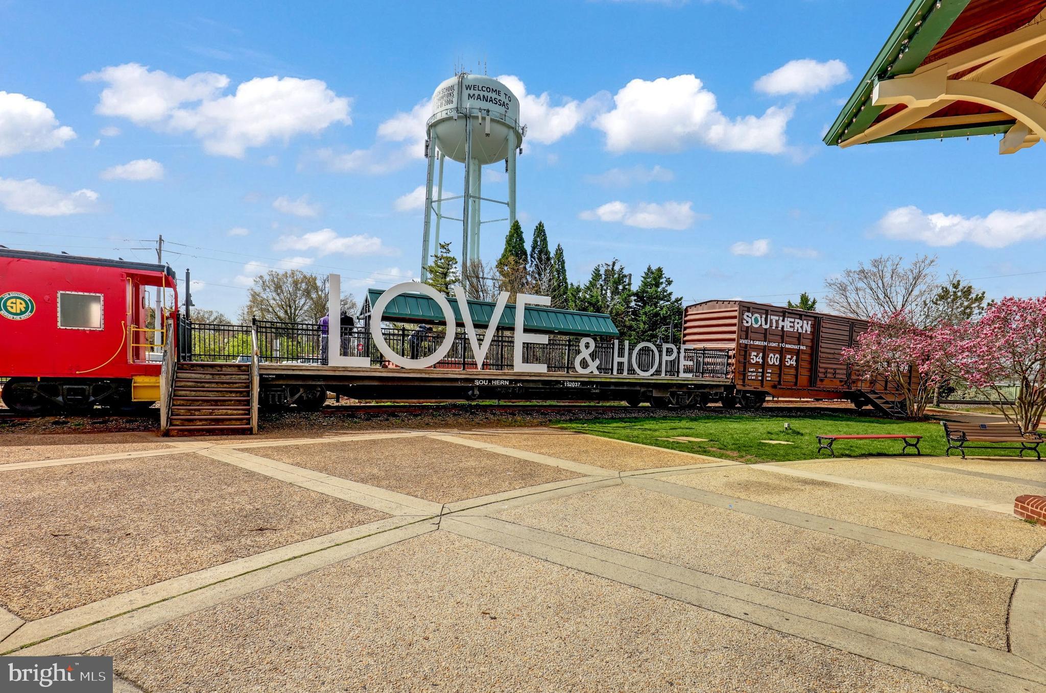 9516 Kimbleton Hall Loop Manassas Park, VA 20111 - Photo 49 of 51 a front view of a building with garden