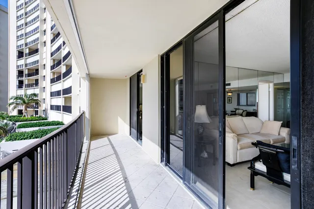 a balcony view with a outdoor seating space